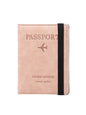 Pink passport holder with black strap on a white background